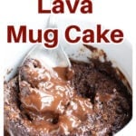 A lava cake in a mug with a spoon.