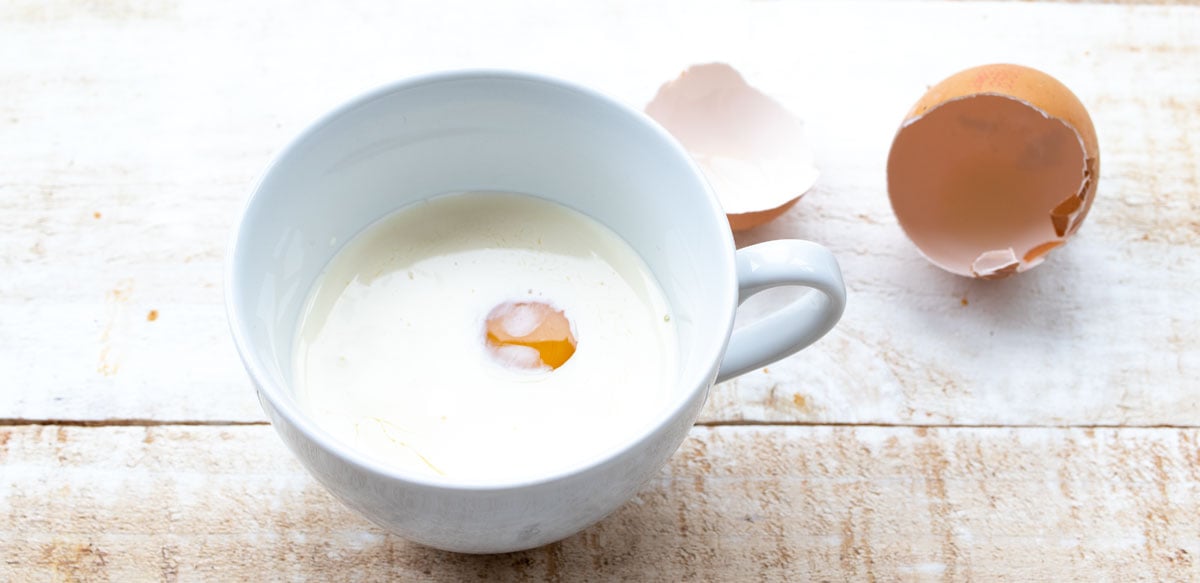 heavy cream ad egg in a mug