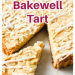 Bakewell tart topped with sliced almonds and icing