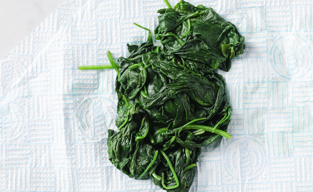 spinach leaves cooked and squeezed dry on kitchen paper