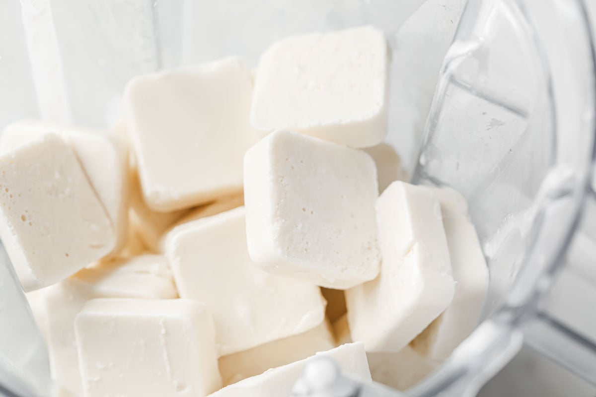 frozen ice cream cubes in a blender jug