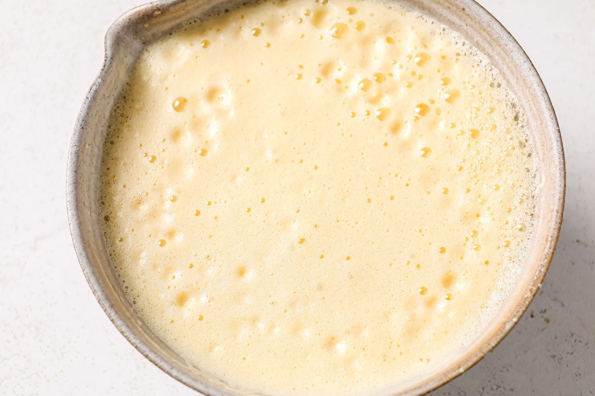 Blended frothy eggs in a bowl.