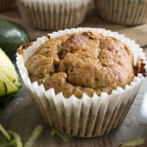 a knot zucchini muffin in a paper casing