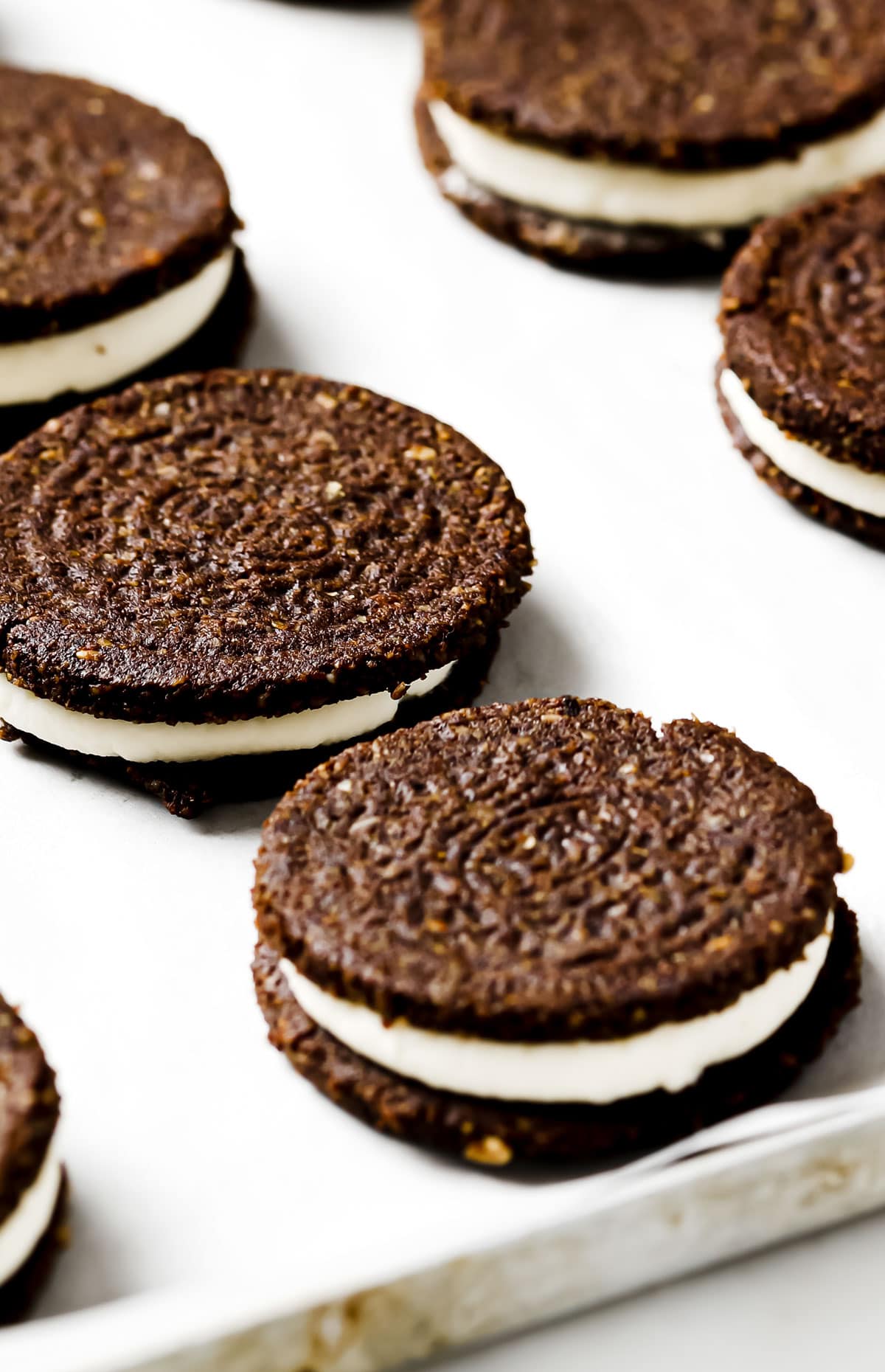 Homemade Oreo chocolate cookies on a cookie sheet.