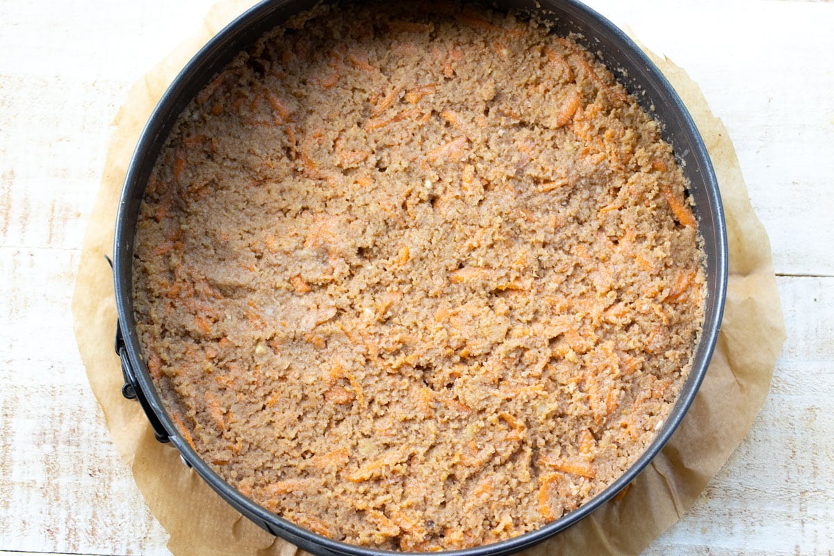 Carrot cake batter in a springform pan.