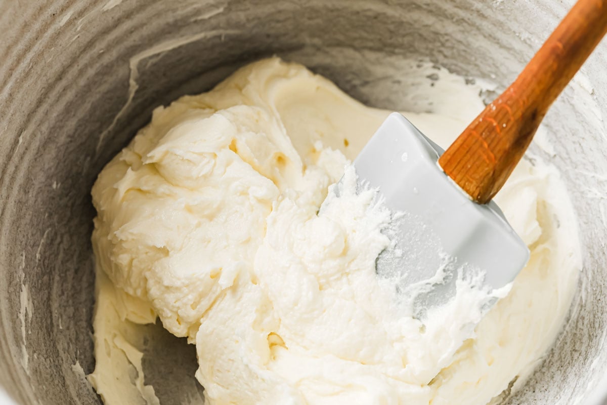 Mixing the filling in a bowl with a spatula.