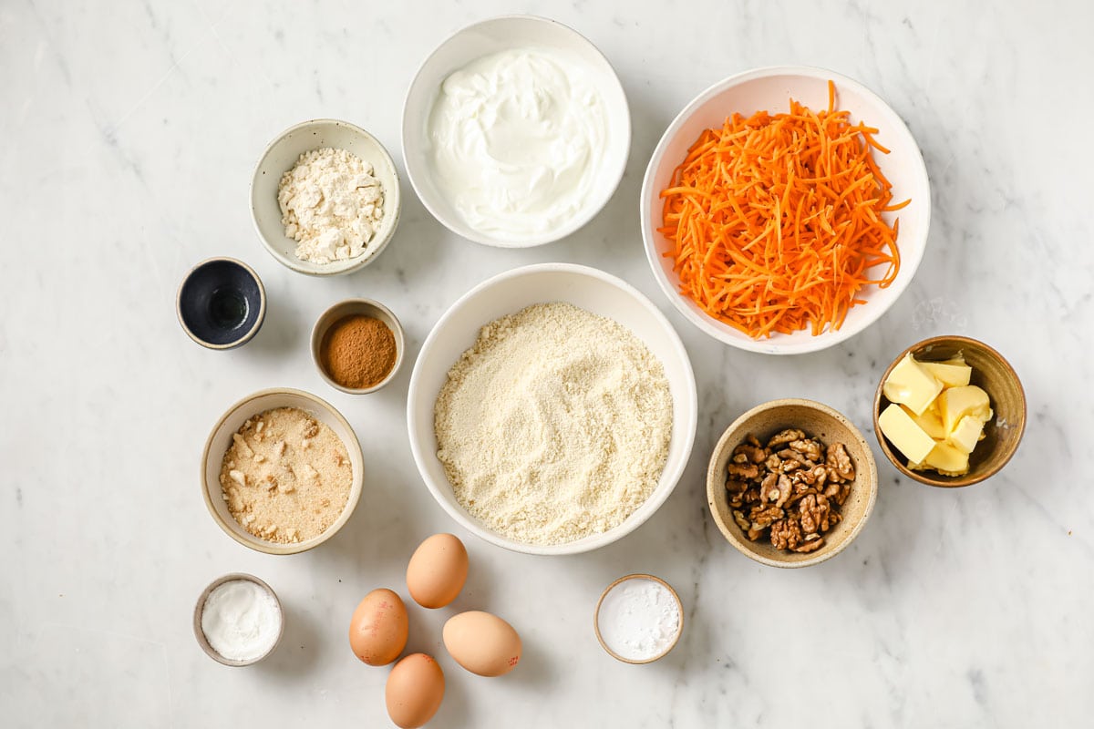 Ingredients for this sugar free carrot cake recipe measured into bowls
