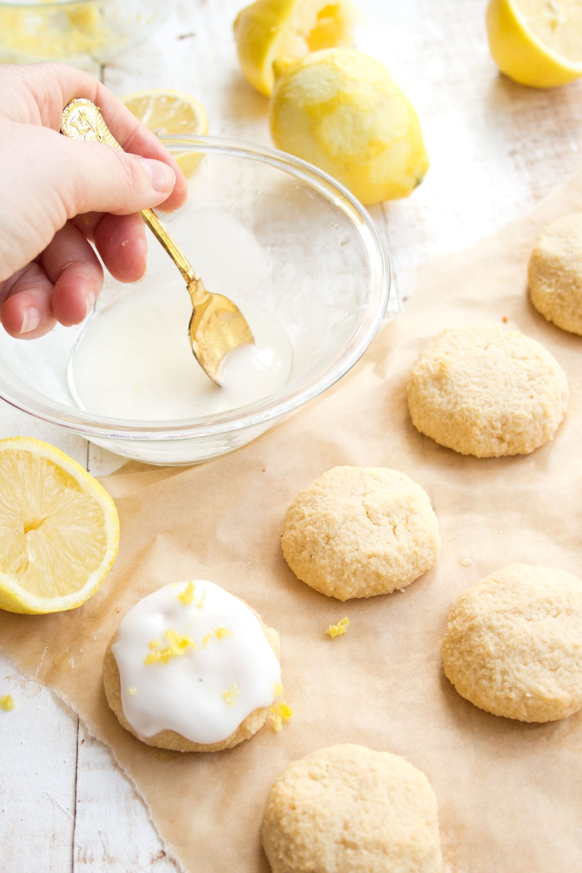 Icing cookies with a spoon.