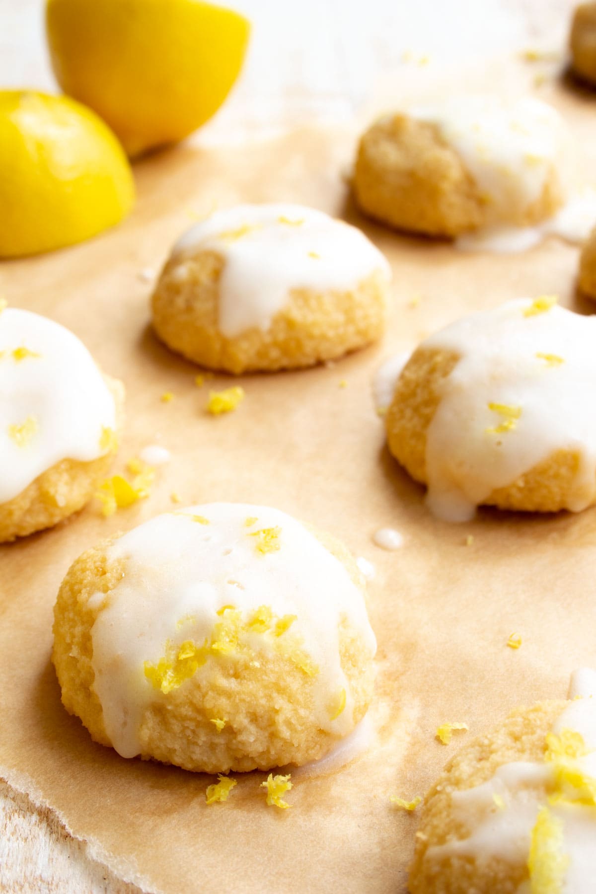 Cookies with icing on parchment paper.