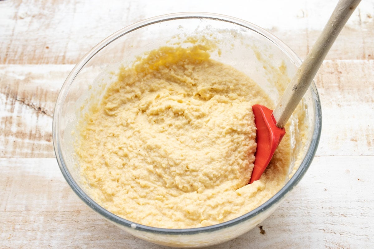 Vanilla batter in a bowl with a spatula.