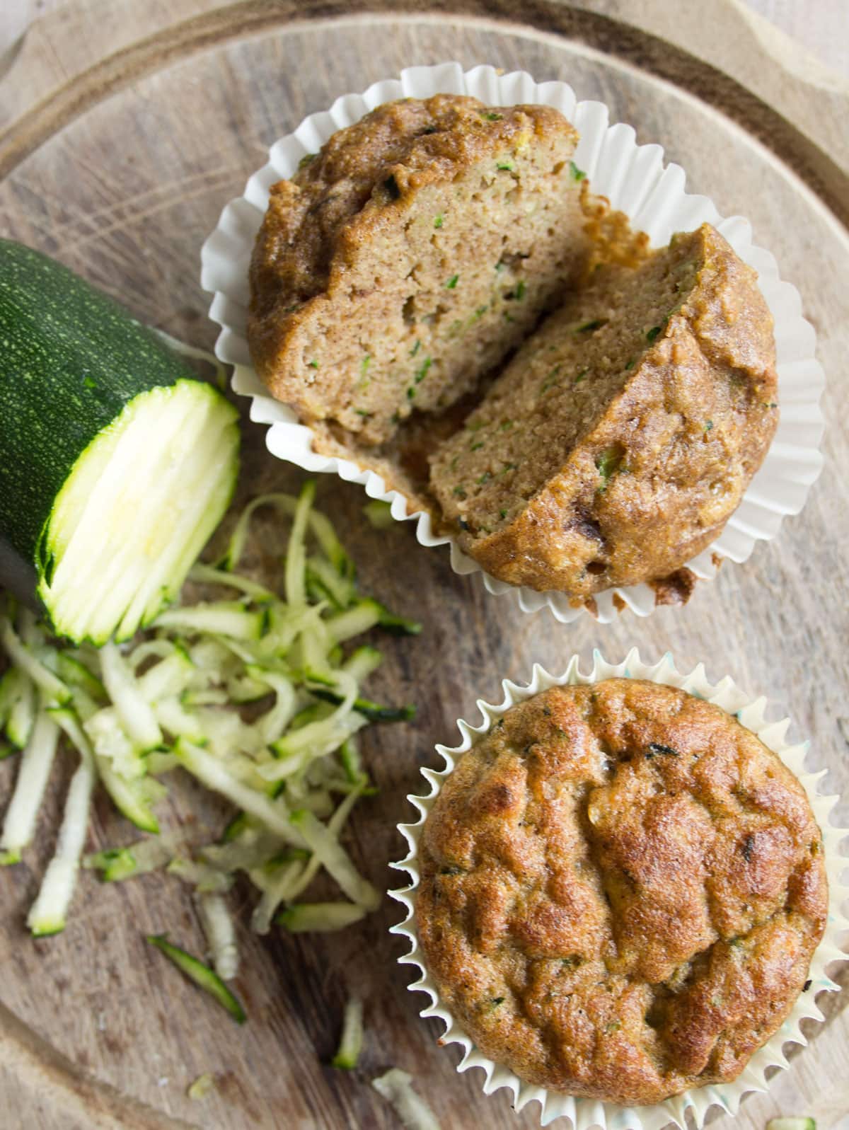 A zucchini muffin sliced in half.