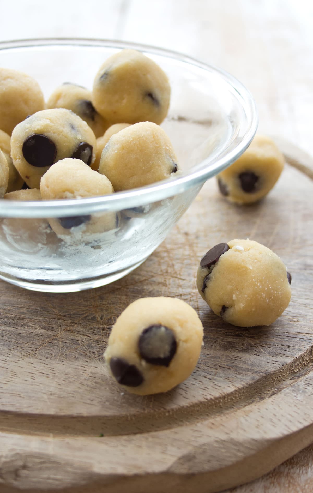 Balls of cookie dough with chocolate chips.