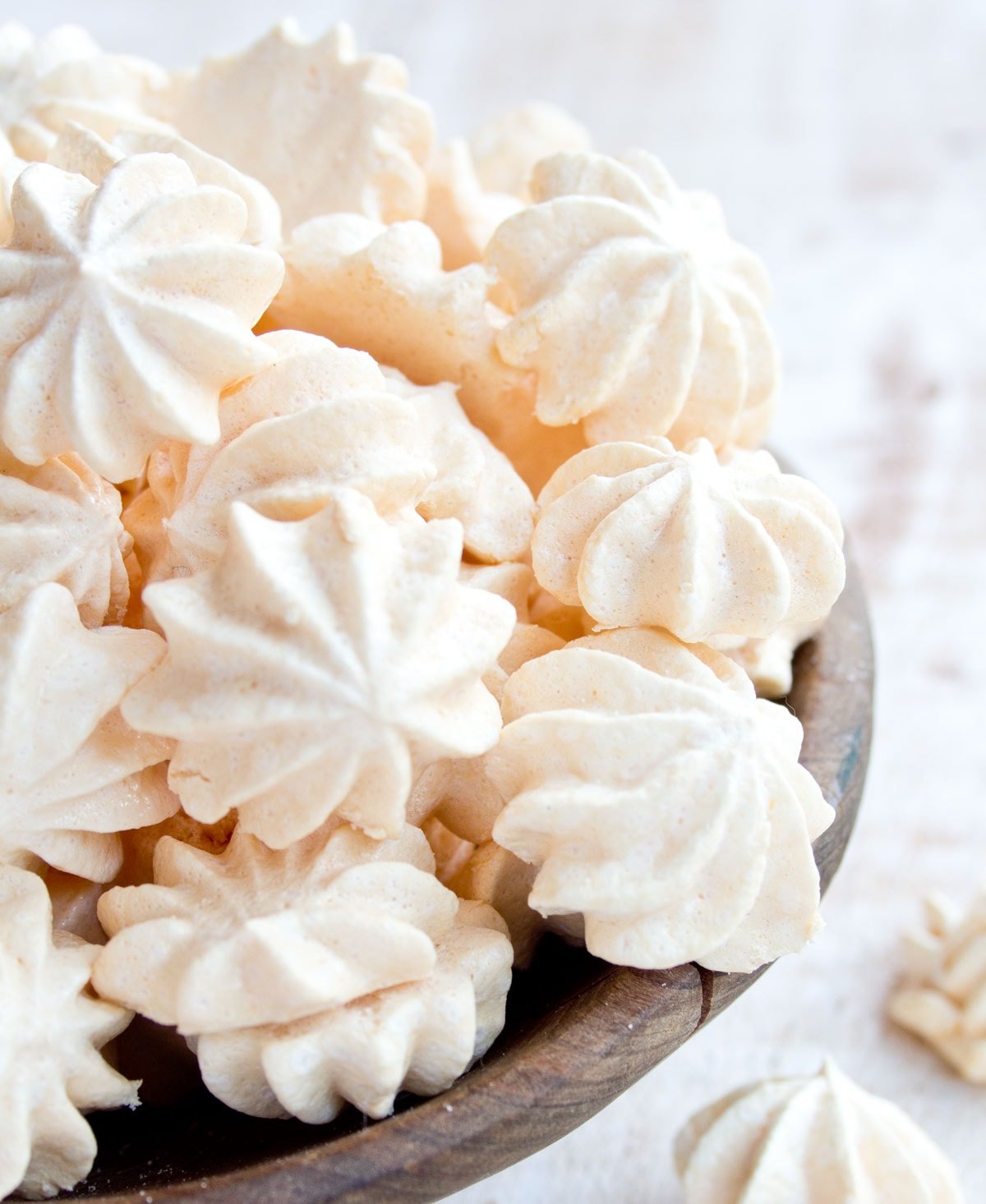 A bowl with meringue cookies.