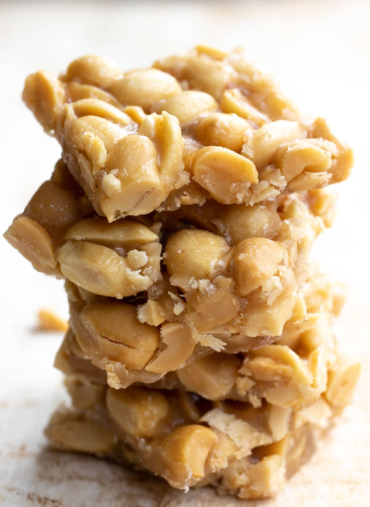 A stack or peanut brittle cut into squares
