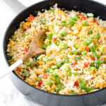 A skillet with cauliflower fried rice.