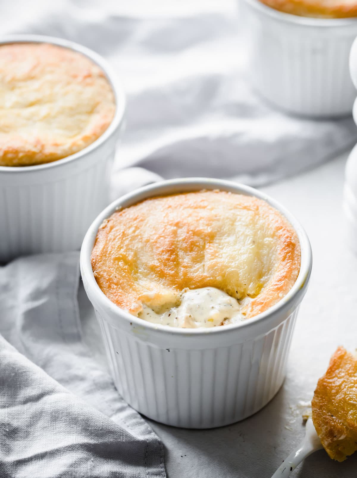 A ramekin with a chicken pot pie.