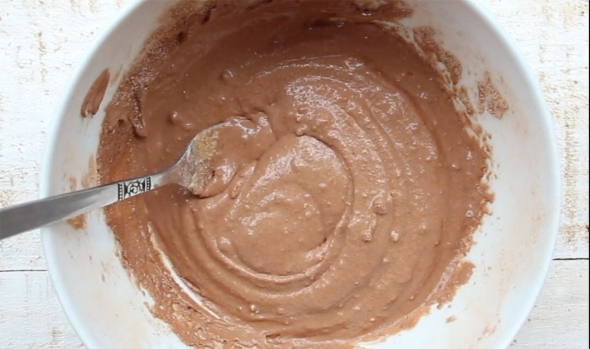 Chocolate batter in a bowl and a fork.