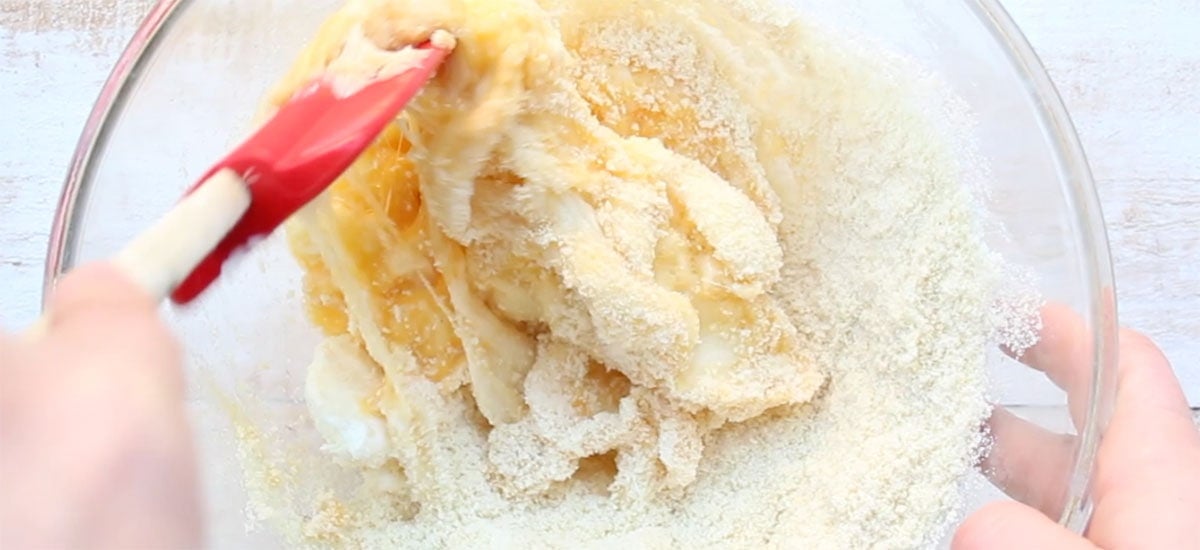Mixing almond flour into the mozzarella mixture.