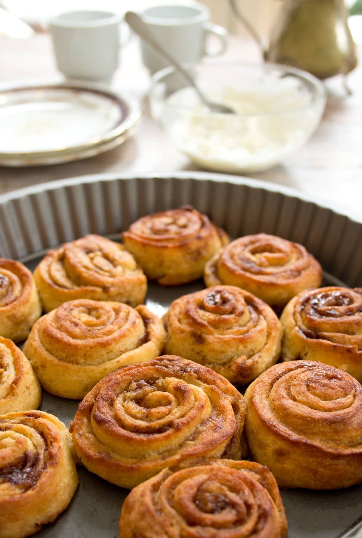 A baking tray with cinnamon rolls.