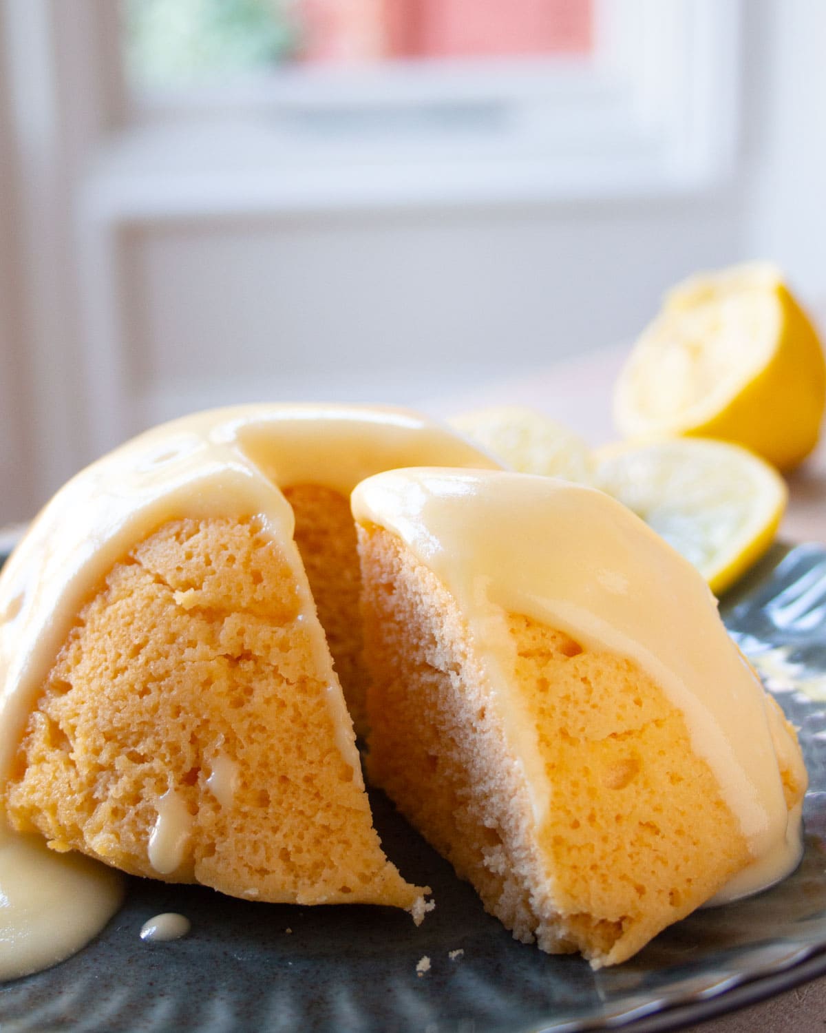A slice cut out of a lemon cake.