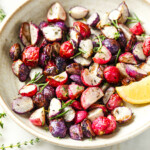 A bowl with roasted radishes.
