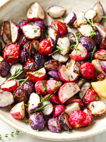 A bowl with roasted radishes.
