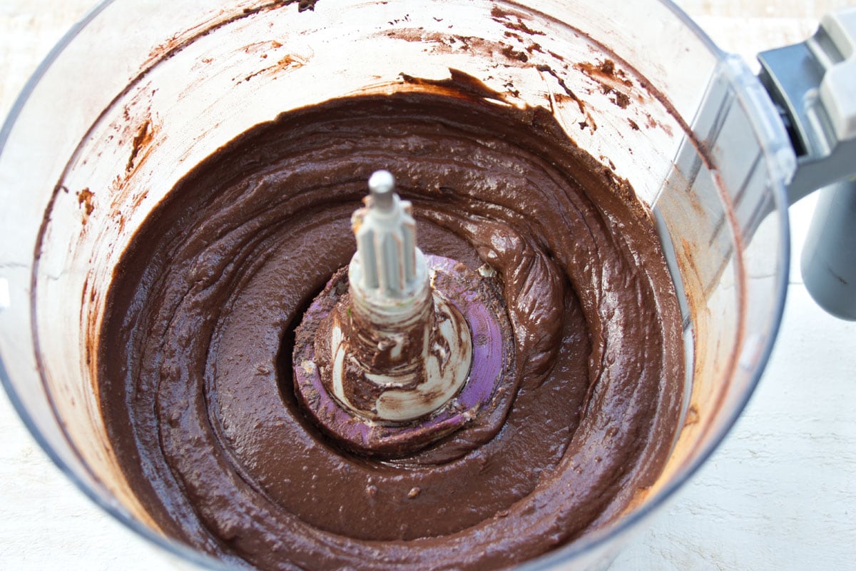 Chocolate pudding blended in a food processor bowl.