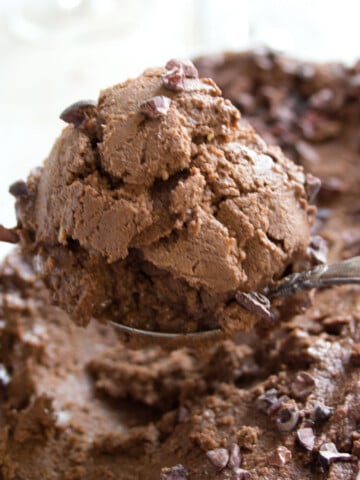 A scoop of avocado chocolate ice cream.