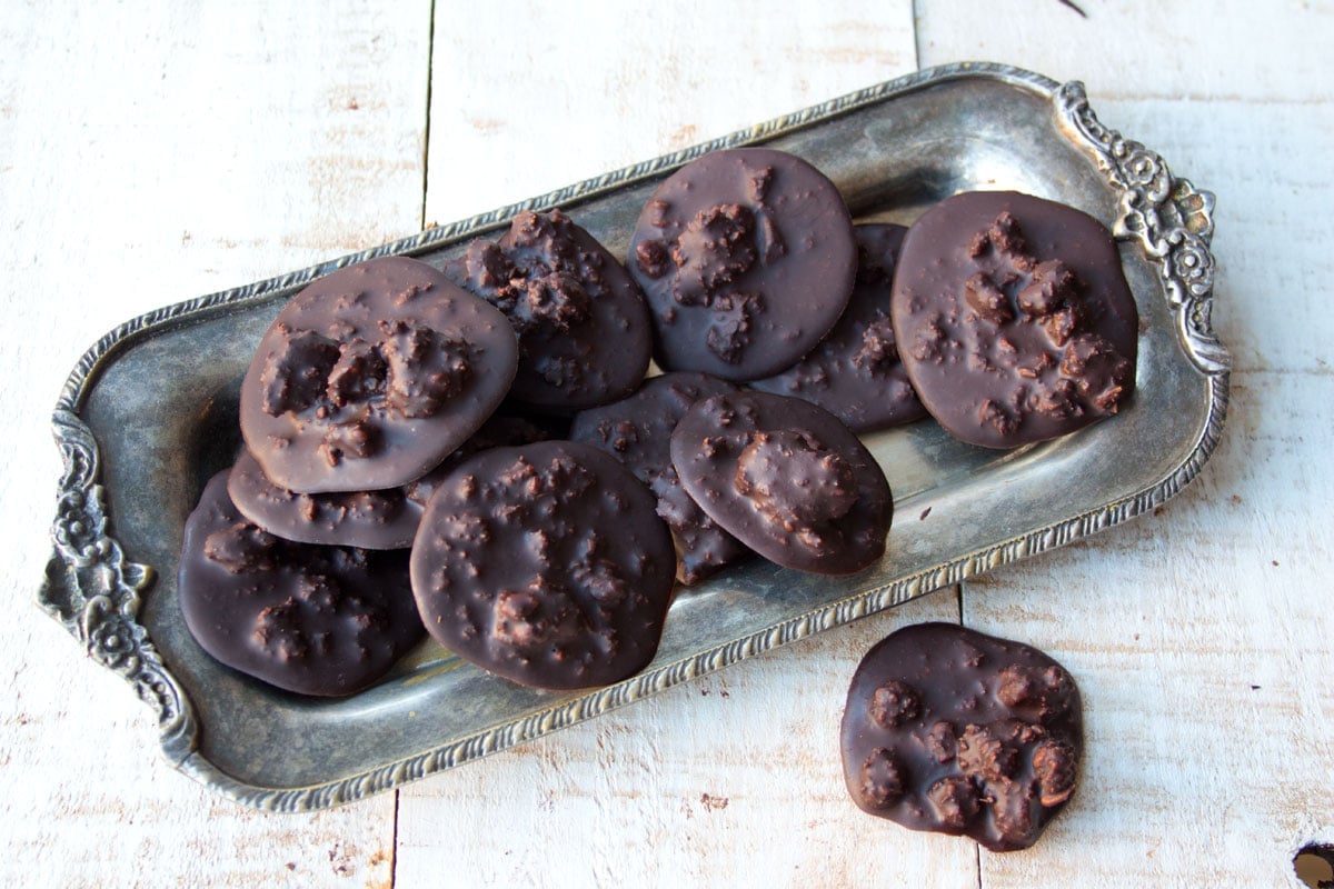 Chocolate pralines on a silver tray.