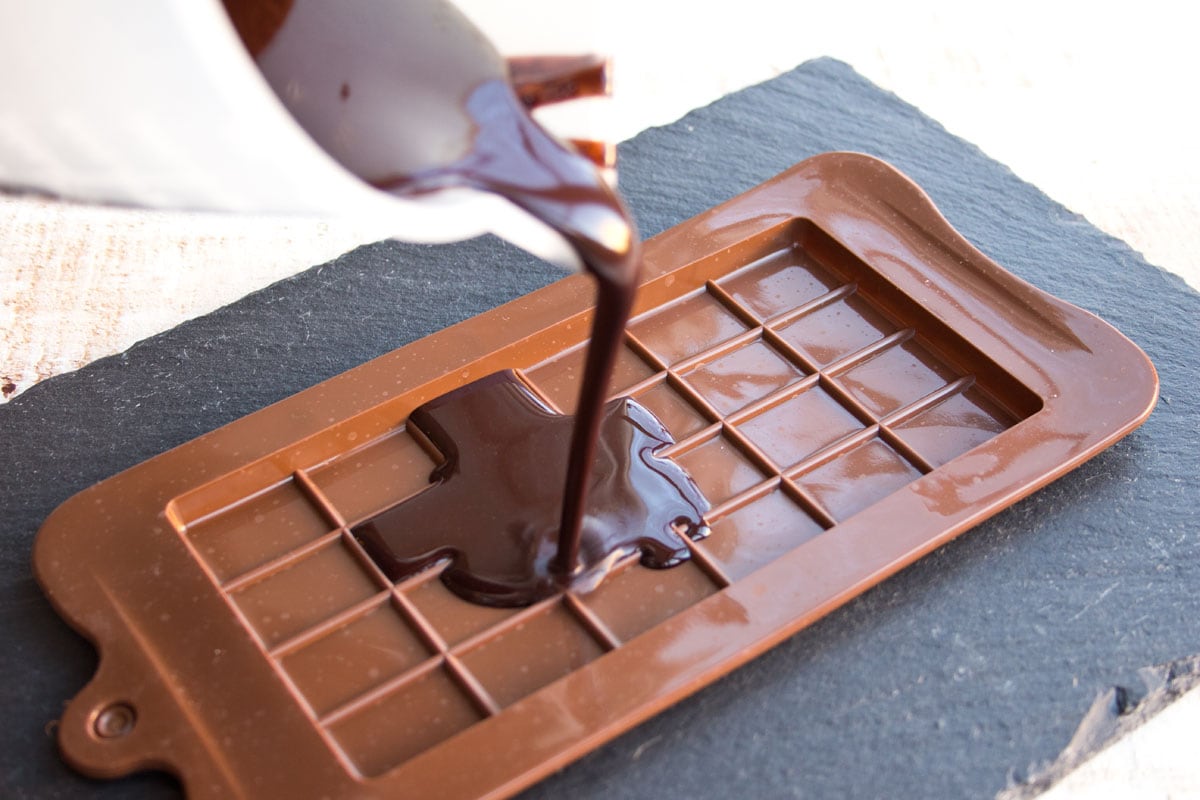 Pouring chocolate into a mould.