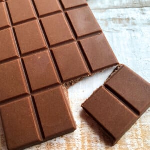 A bar of milk chocolate, 2 squares broken off.