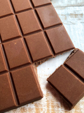 A bar of milk chocolate, 2 squares broken off.