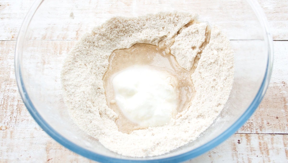 Ingredients for naan bread in a bowl.