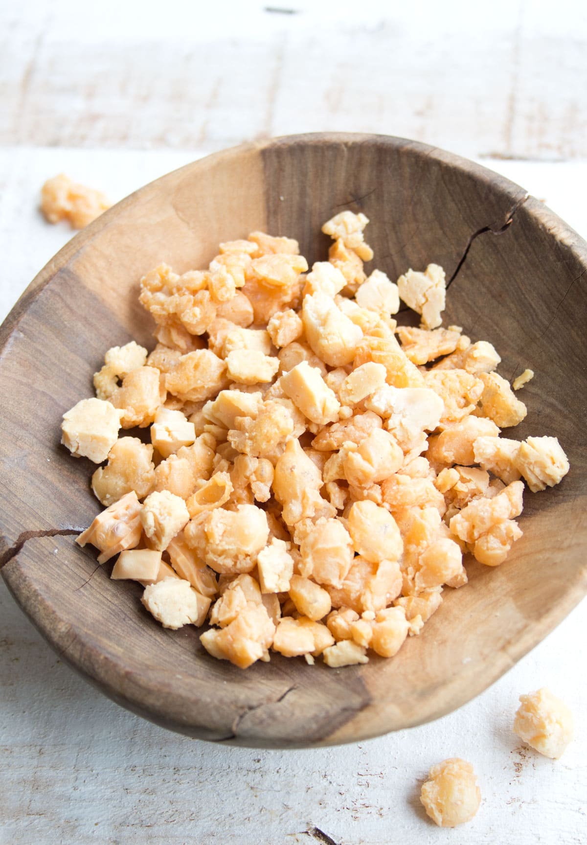 Puffed cheese in a wooden bowl.