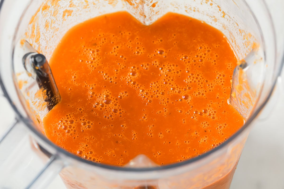 Tomato soup in a blender bowl.