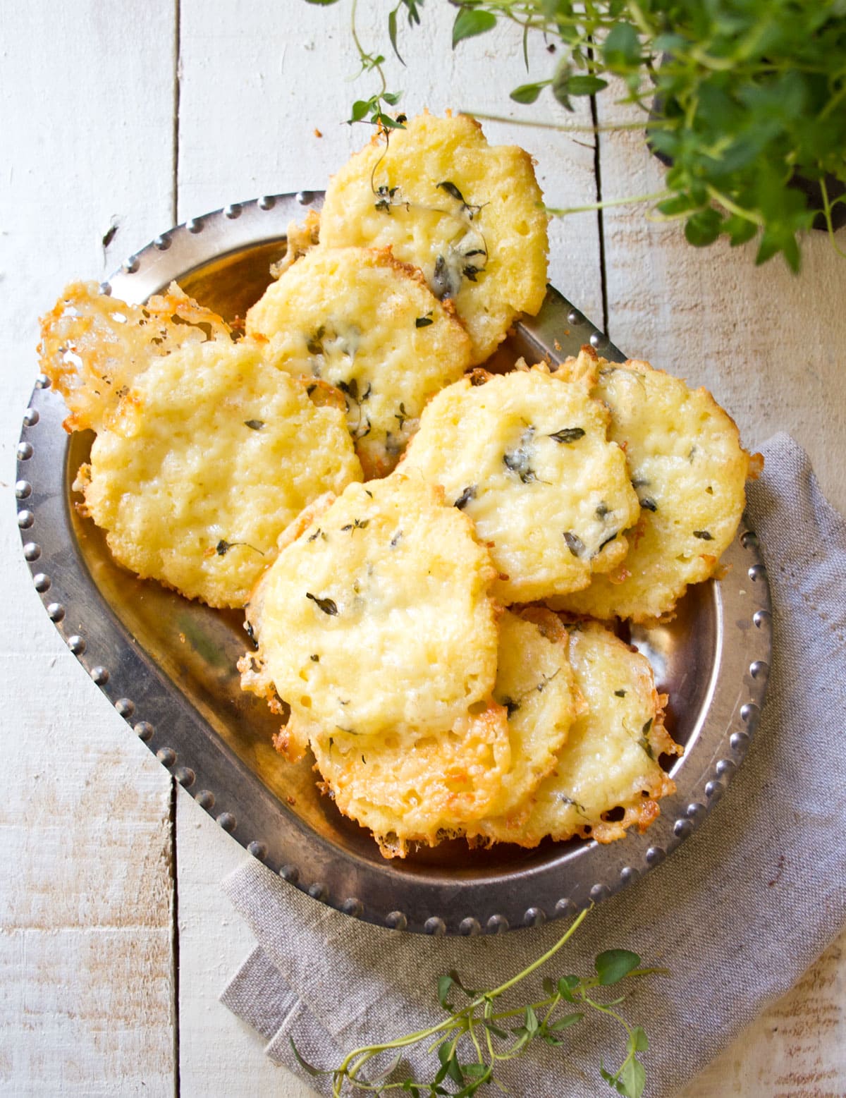 Cheese coconut crackers in a silver bowl.