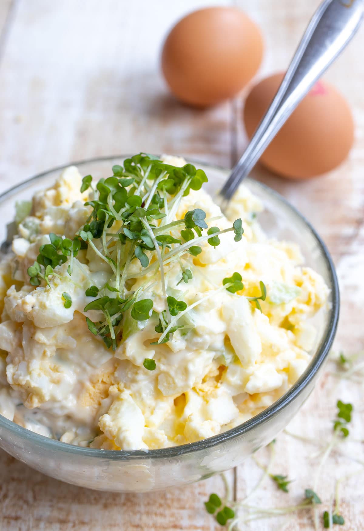 A bowl with egg salad.