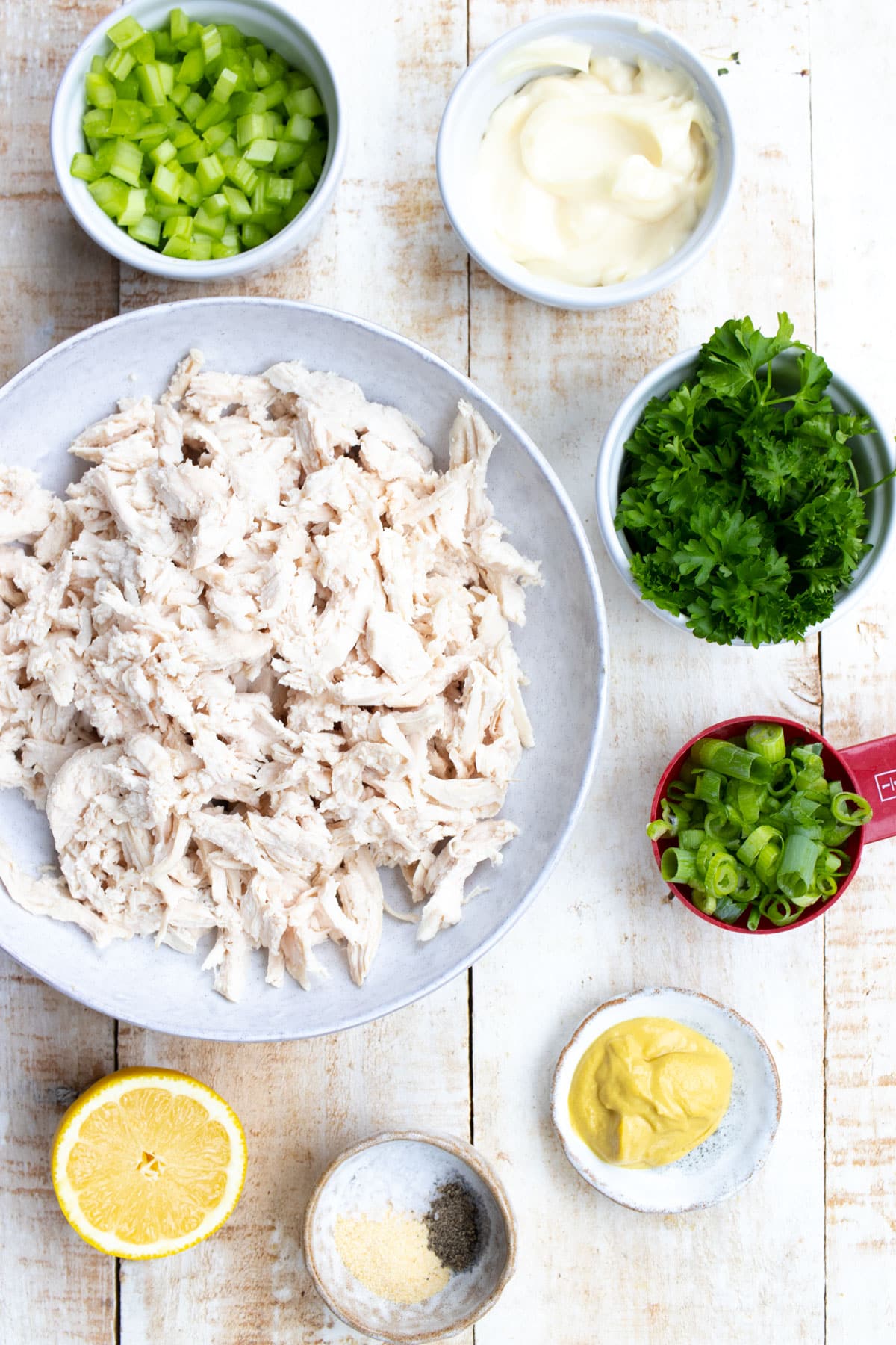 Ingredients for keto chicken salad measured into bowls.