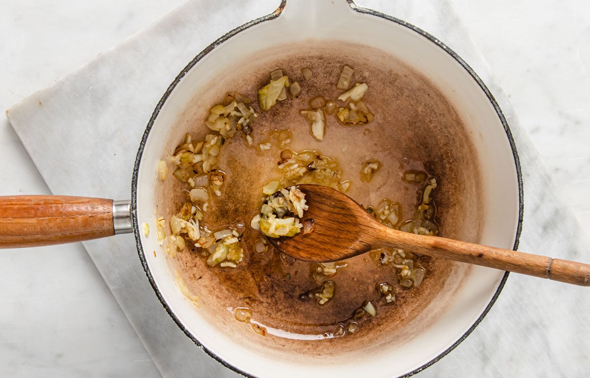 Frying garlic in a pan.