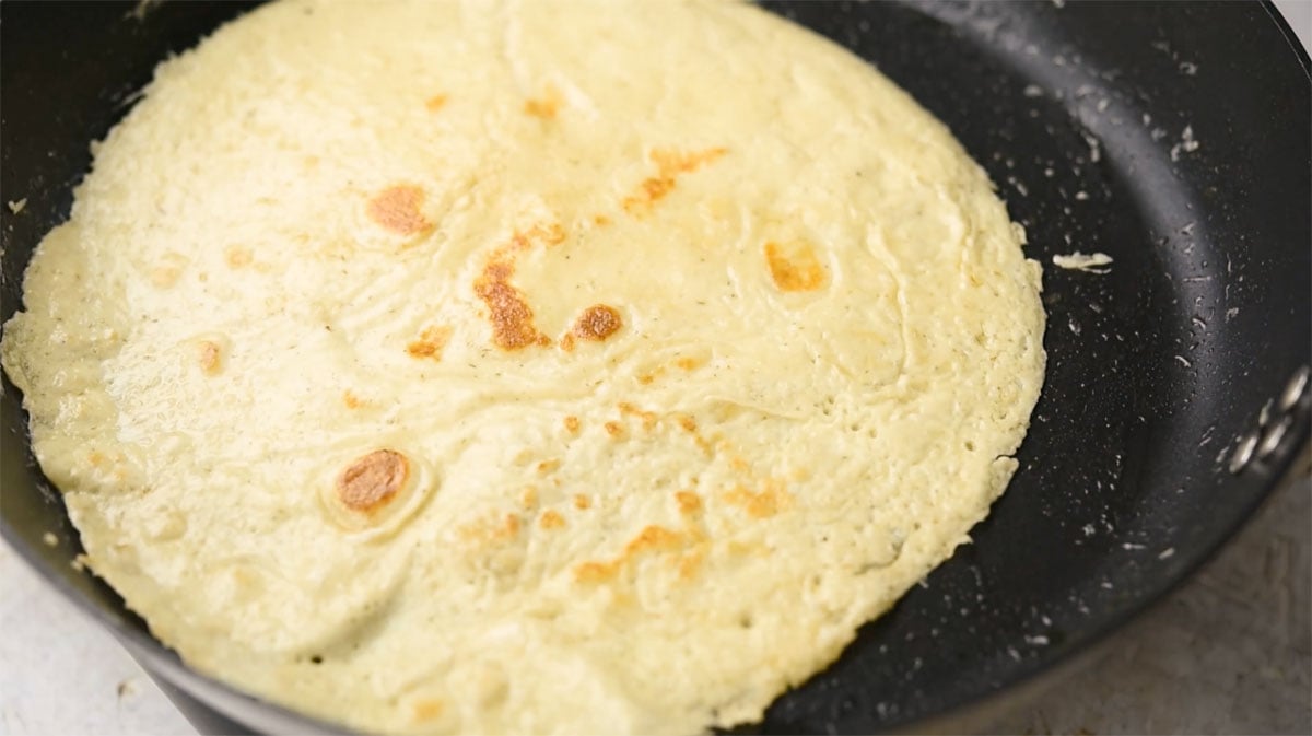 Baked crepe in a frying pan.