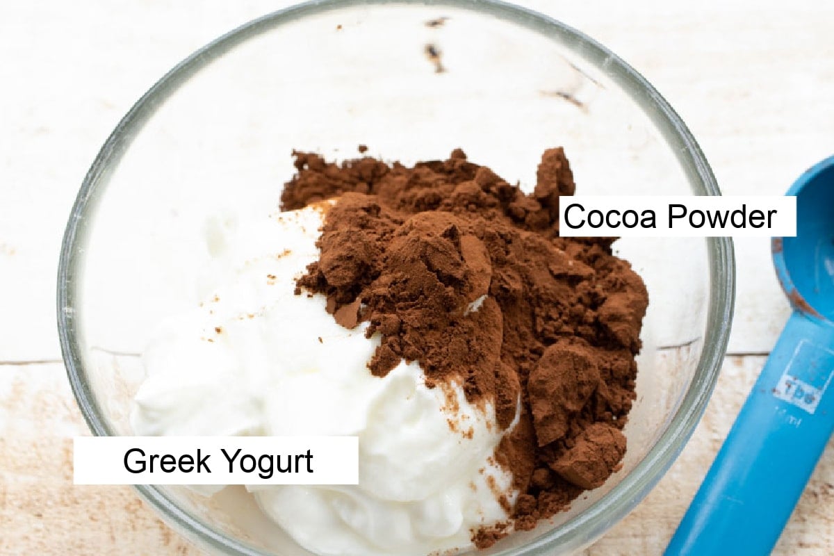 A bowl with Greek yogurt and cocoa powder, labelled.
