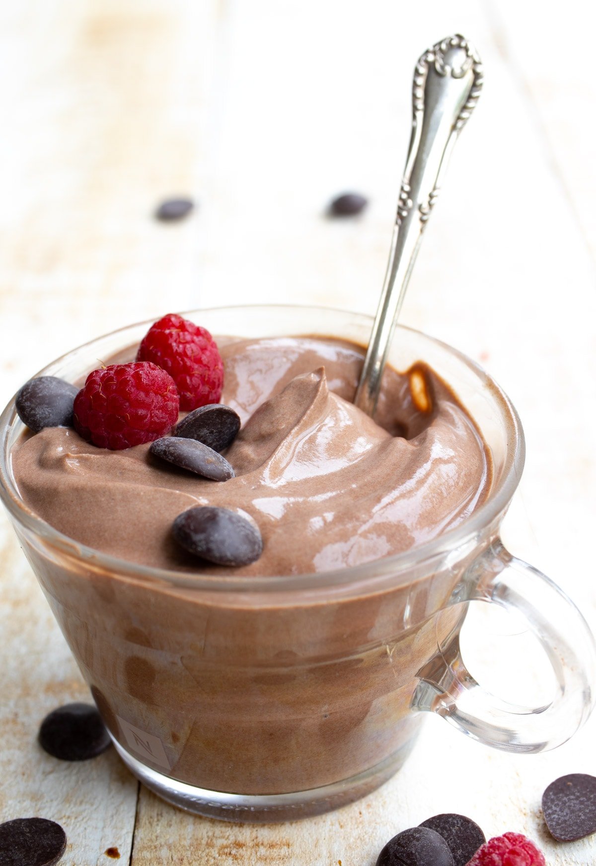 Chocolate yogurt in a glass cup.