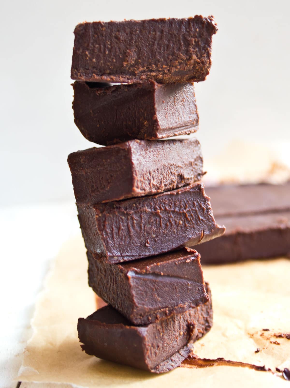 A stack of chocolate peanut butter fudge squares.