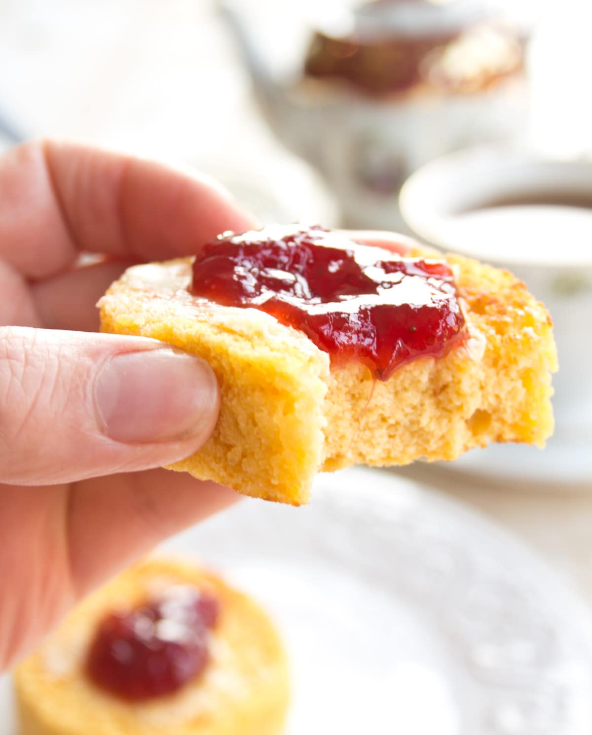 An English muffin topped with strawberry jam.