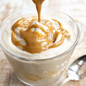 Drizzling peanut butter over yogurt.