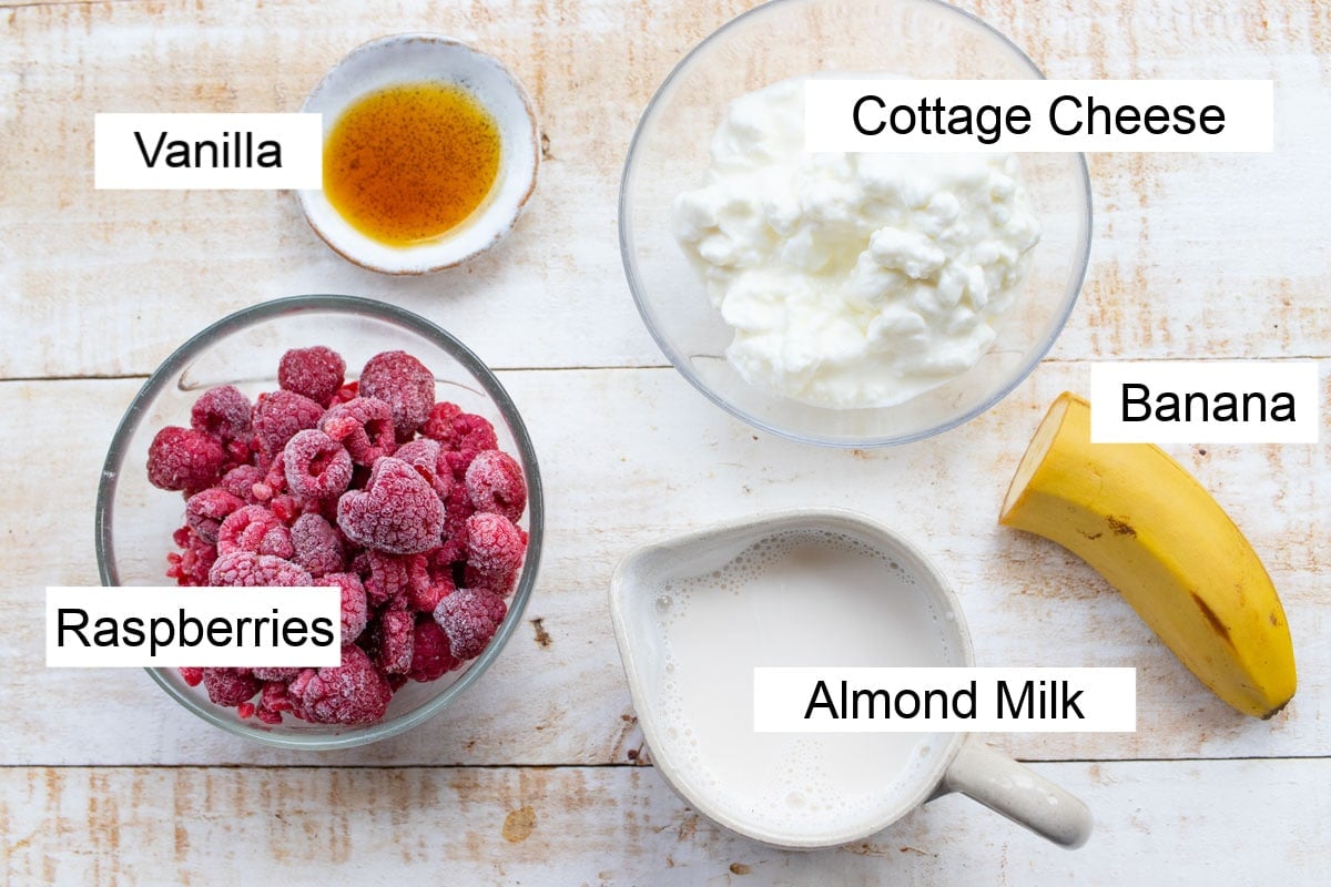 Ingredients for this smoothie recipe, measured into bowls and labelled.