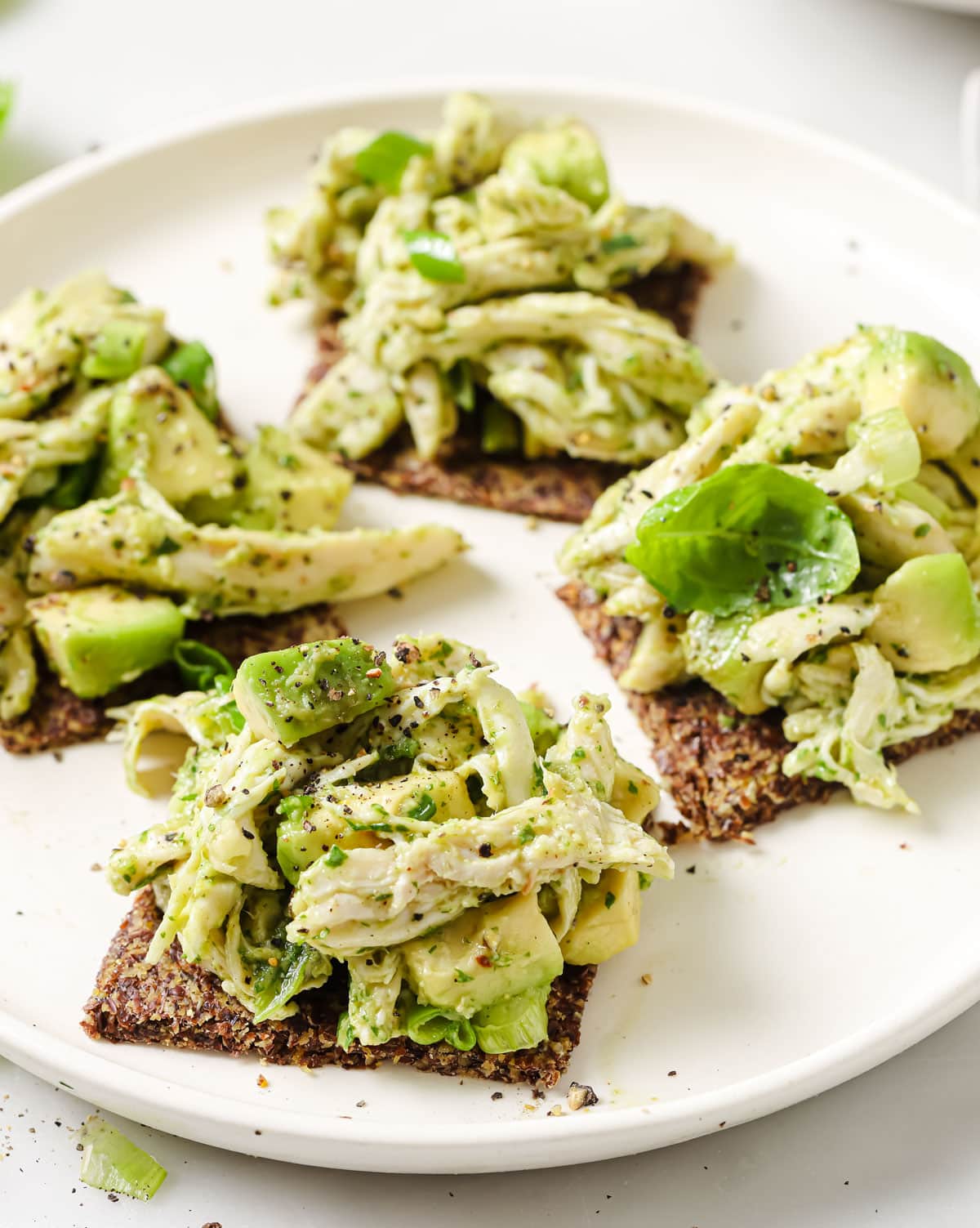 Chicken avocado salad on flax crackers.