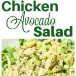 A chicken avocado salad on a bed of rocket leaves.