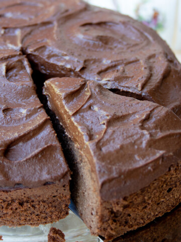 A slice of chocolate avocado cake with chocolate avocado frosting.