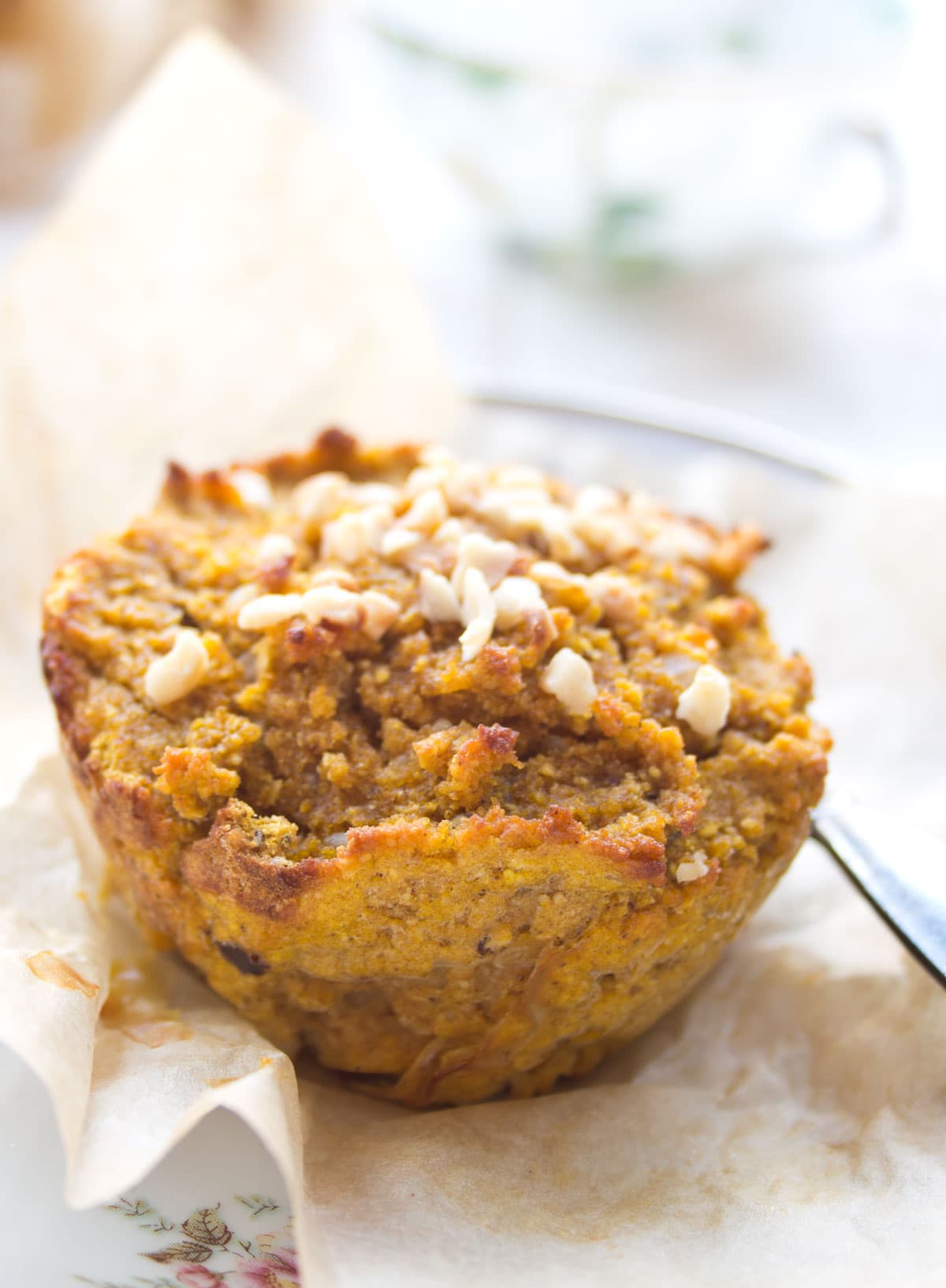 Pumpkin coconut flour muffin on parchment paper.